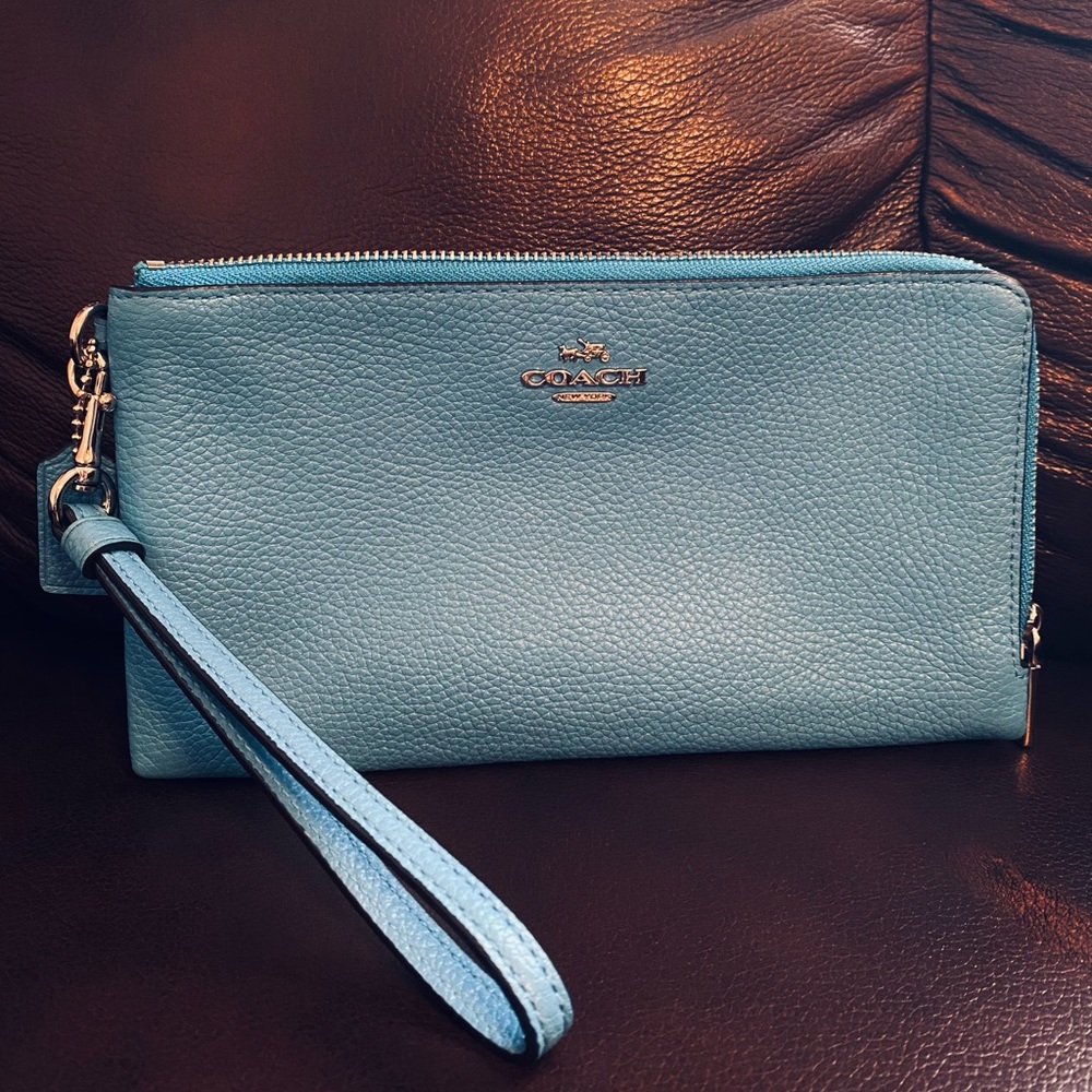 Sky blue COACH wristlet. Mint condition.